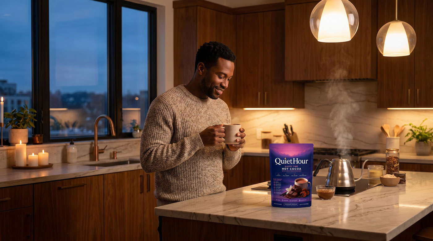Man preparing QuietHour cocoa in a warm modern kitchen at dusk